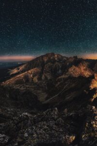 mountain at night under a starry sky